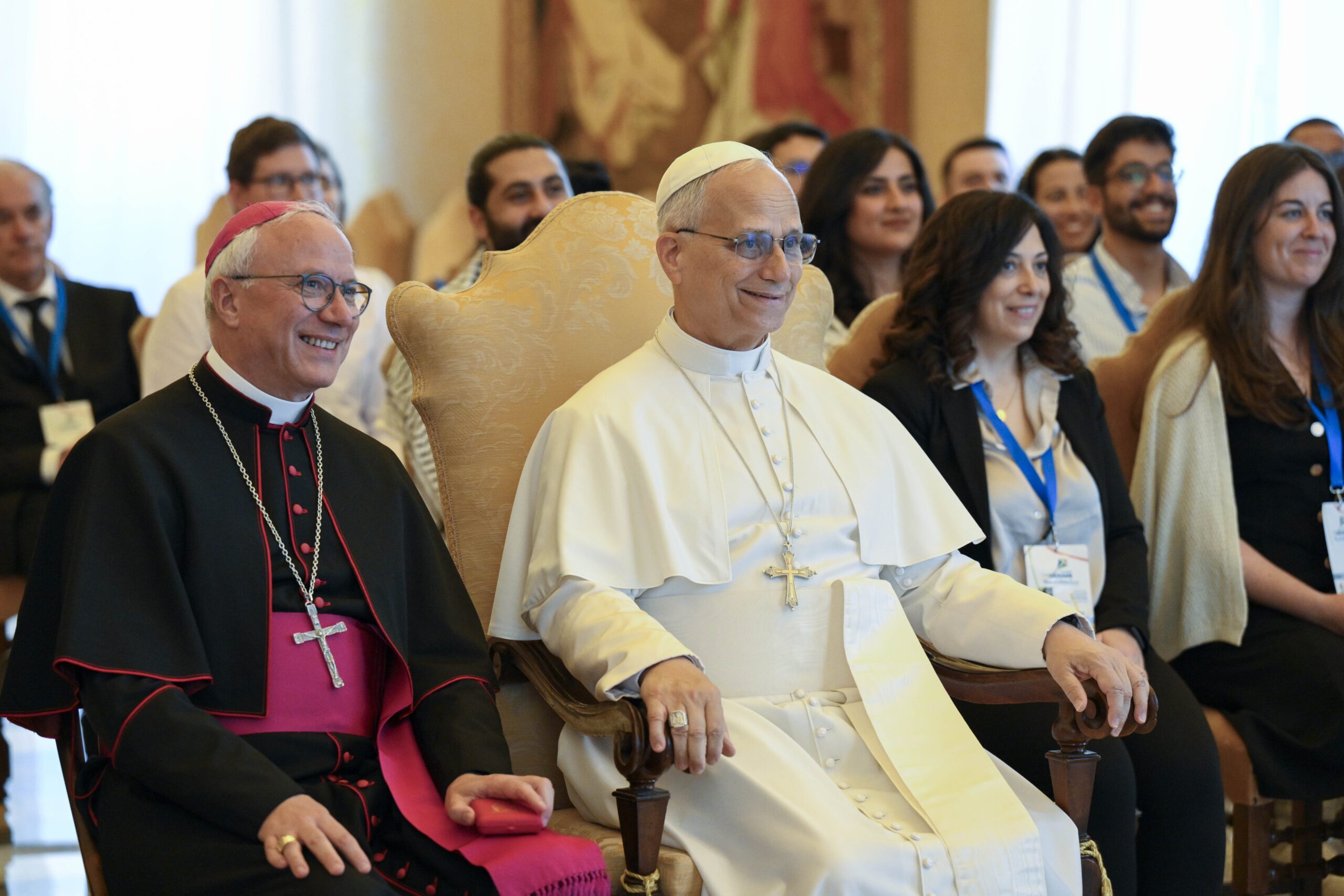 Pope Leo XIV poses for a photo with Italian Archbishop Giuseppe Baturi of Cagliari, secretary-general of the Italian bishops' conference, and members of the Youth Council of the Mediterranean at the Vatican Sept. 5, 2025. The council, coordinated by the Italian bishops, includes young adult representatives from more than a dozen Mediterranean countries. (CNS photo/Vatican Media)