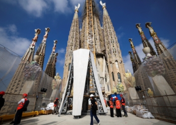 Journalists visit a working area at outside Sagrada Familia following a news conference to announce an update on the works of the cathedral in Barcelona, Spain, Sept. 18, 2025. Over a century in the making, the Tower of Jesus Christ, designed by the famed Spanish architect, will soon crown the Basilica of the Sagrada Familia in Barcelona, making it the tallest Catholic Church in the world. (OSV News photo/Albert Gea, Reuters)