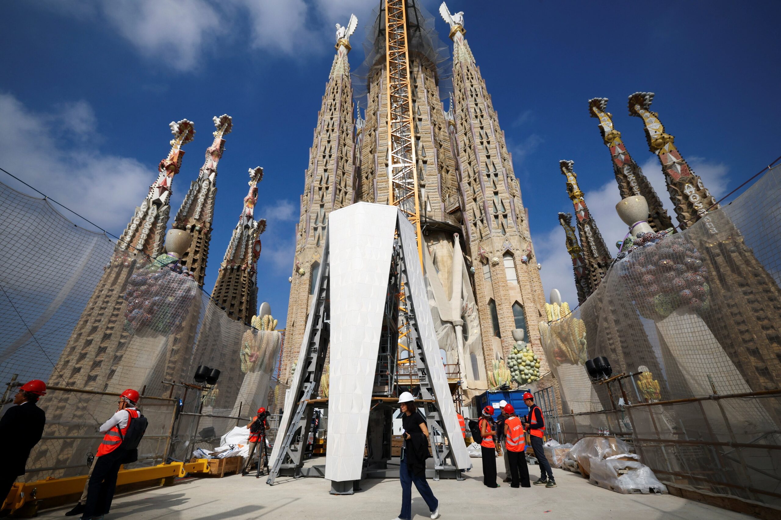 Journalists visit a working area at outside Sagrada Familia following a news conference to announce an update on the works of the cathedral in Barcelona, Spain, Sept. 18, 2025. Over a century in the making, the Tower of Jesus Christ, designed by the famed Spanish architect, will soon crown the Basilica of the Sagrada Familia in Barcelona, making it the tallest Catholic Church in the world. (OSV News photo/Albert Gea, Reuters)