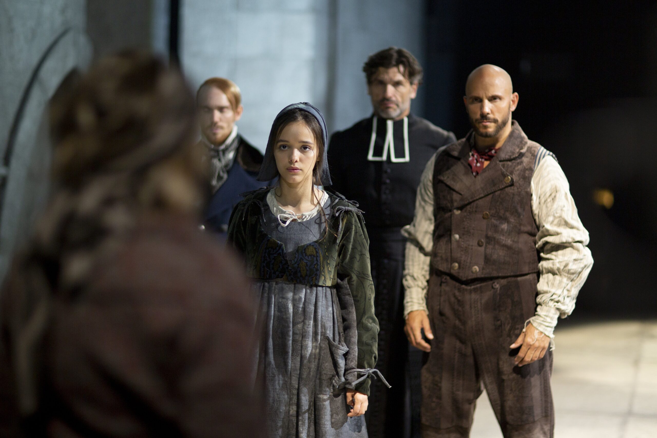 Eyma Scharen, who plays St. Bernadette, and other cast members appear on stage in the musical "Bernadette of Lourdes." (OSV News photo/Fathom Productions)