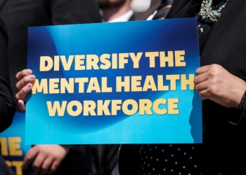 A mental health advocate holds a sign during a press conference on the proposed Mental Health Workforce Act April 10, 2024, on Capitol Hill in Washington. In recognition of the continuing mental health crisis in our nation, the U.S. Conference of Catholic Bishops announced a new component of its National Catholic Mental Health Campaign in September 2025, “Healing and Hope." (OSV News photo//Michael A. McCoy, Reuters)