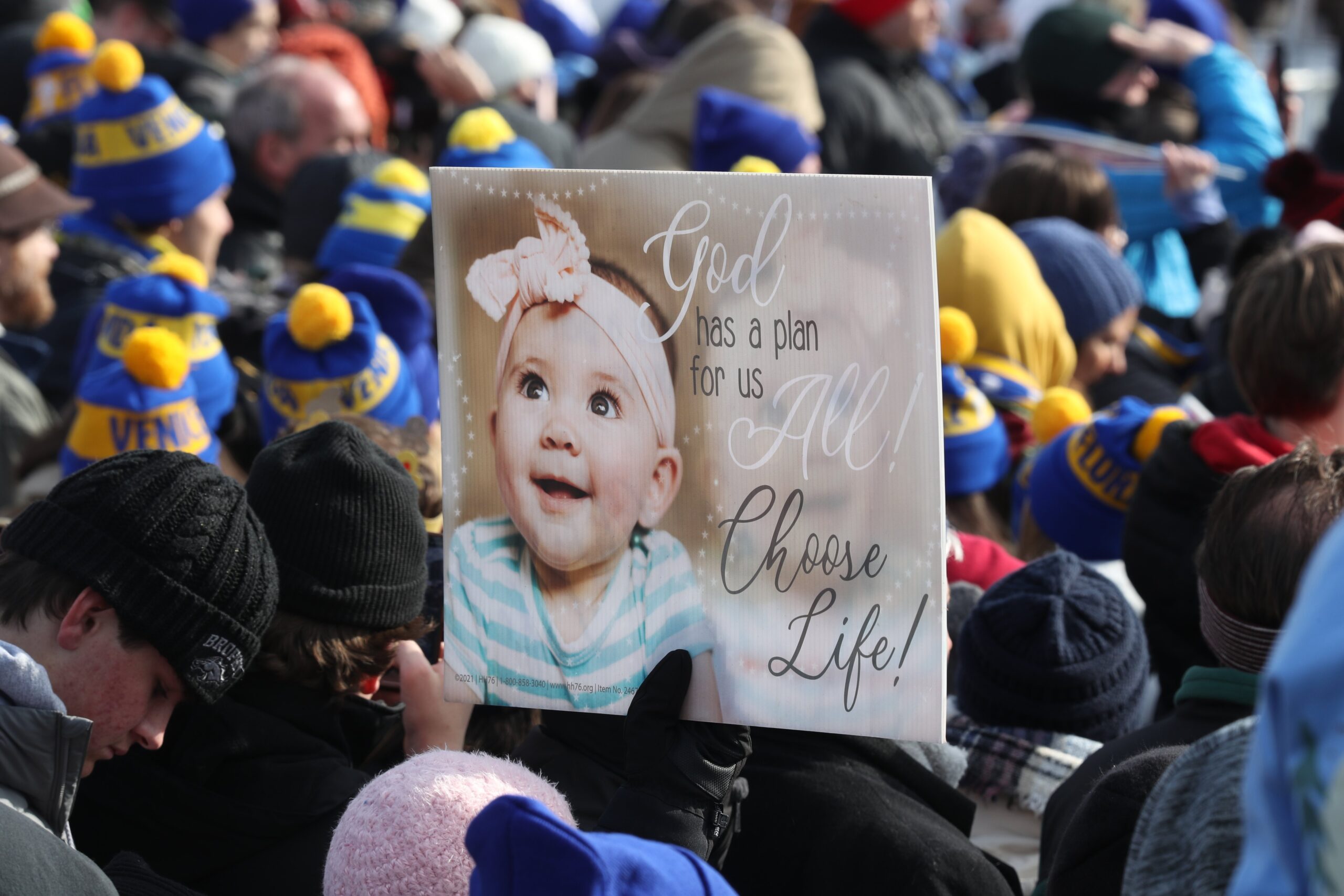An attendee holds a poster during the 52nd annual March for Life rally in Washington Jan. 24, 2025. (OSV News photo/Bob Roller).