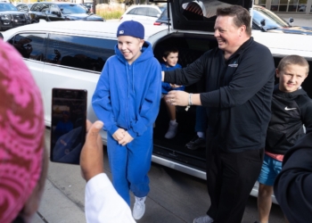 Sophia Forchas and her father, Tom Forchas, exit a limousine at Hennepin County Medical Center in downtown Minneapolis Oct. 23, 2025, just after her release from Gillette Children’s Hospital in St. Paul. A police escort led by Minneapolis Police Chief Brian O’Hara arrived at HCMC for a brief visit with hospital staff there who treated Forchas after she was hit during the Aug. 27 shooting at Annunciation church in Minneapolis. (OSV News photo/Dave Hrbacek, The Catholic Spirit)