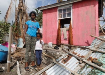 Camilla Powell 27, and daughter Destiny Ellington, 5, stand outside of their home in Alligator Pond, Jamaica, Oct. 29, 2025, after Hurricane Melissa swept through the area. Melissa made landfall Oct. 28 in Jamaica around 1 p.m. ET as a catastrophic Category 5 storm with top winds of 185 mph. One of the strongest Atlantic hurricanes on record, Melissa has left dozens dead and widespread destruction across Jamaica, Cuba and Haiti. (OSV News photo/Octavio Jones, Reuters)