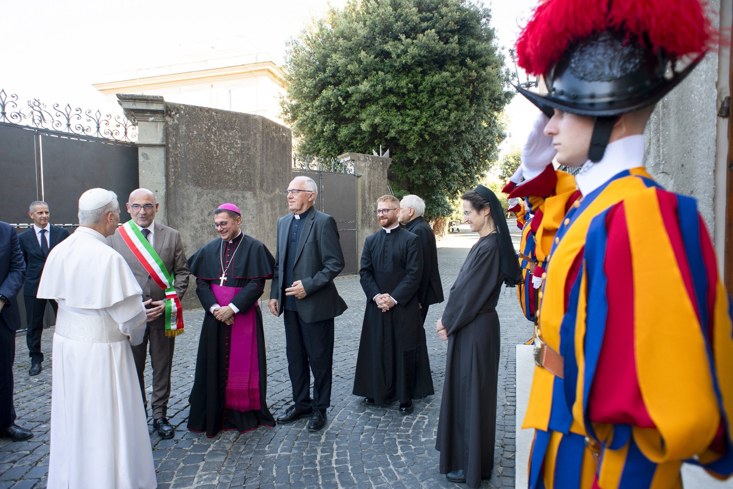 Pope Leo XIV is welcomed by local officials, clergy and members of the Swiss Guard as he arrives at Villa Barberini in Castel Gandolfo, Italy, in this file photo from July 6, 2025. The pope has been spending Tuesdays at the villa and usually speaks to reporters before returning to the Vatican. (CNS photo/Vatican Media)
