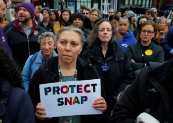 A woman holds a sign during "A Rally for SNAP" on the steps of the Massachusetts Statehouse in Boston Oct. 28, 2025, as it is anticipated food aid benefits will be suspended starting Nov. 1 amid the ongoing U.S. government shutdown. (OSV News photo/Brian Snyder, Reuters)
