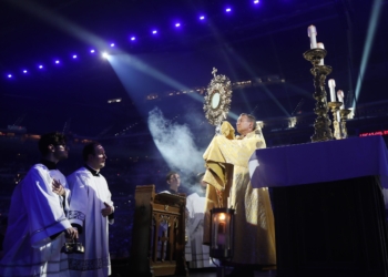 Bishop Andrew H. Cozzens of Crookston, Minn., chairman of the board of the National Eucharistic Congress Inc., blesses pilgrims July 17, 2024, during adoration at the opening revival night of the 10th National Eucharistic Congress at Lucas Oil Stadium in Indianapolis. (OSV News photo/Bob Roller)