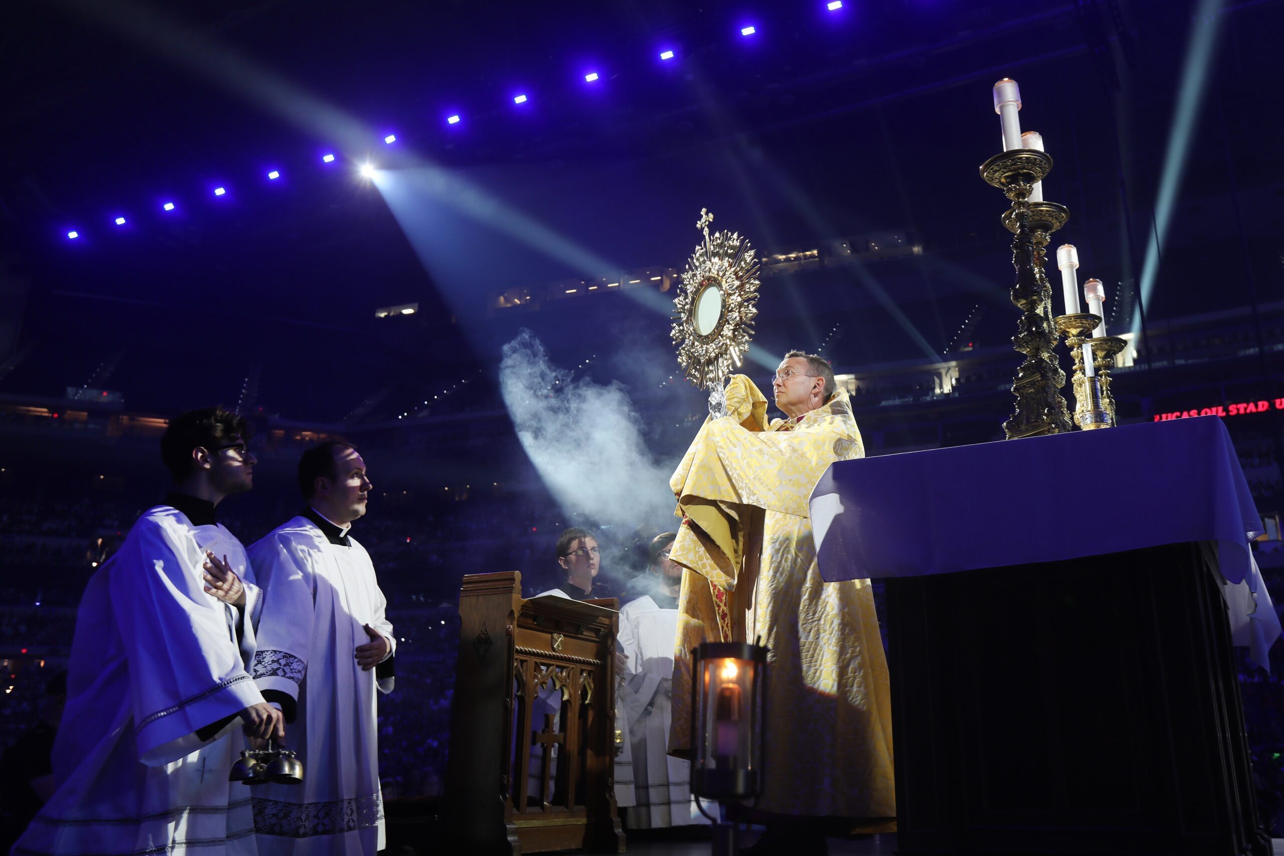 Bishop Andrew H. Cozzens of Crookston, Minn., chairman of the board of the National Eucharistic Congress Inc., blesses pilgrims July 17, 2024, during adoration at the opening revival night of the 10th National Eucharistic Congress at Lucas Oil Stadium in Indianapolis. (OSV News photo/Bob Roller)