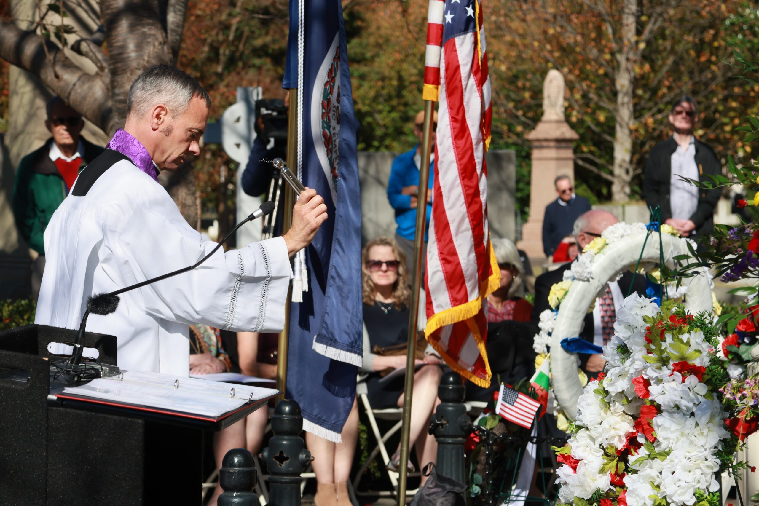 Father Anthony Marques, rector of the Cathedral of the Sacred Heart, Richmond, Va., sprinkles holy water on the grave of Eliza Monroe Hay at Hollywood Cemetery in Richmond Oct. 23, 2025.  (OSV News photo/D. Hunter Reardon, The Catholic Virginian)