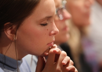 A young woman prays at the National Prayer Vigil for Life in Washington Jan. 19, 2023. (OSV News photo/Bob Roller)