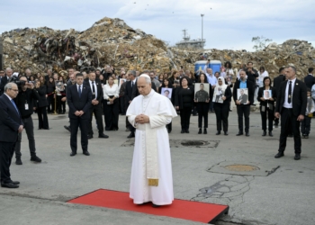 Standing amid the rubble and with the loved ones of people killed behind him, Pope Leo XIV prays at a memorial marking the site of a deadly explosion in 2020 at the port in Beirut Dec. 2, 2025. (CNS photo/Vatican Media)