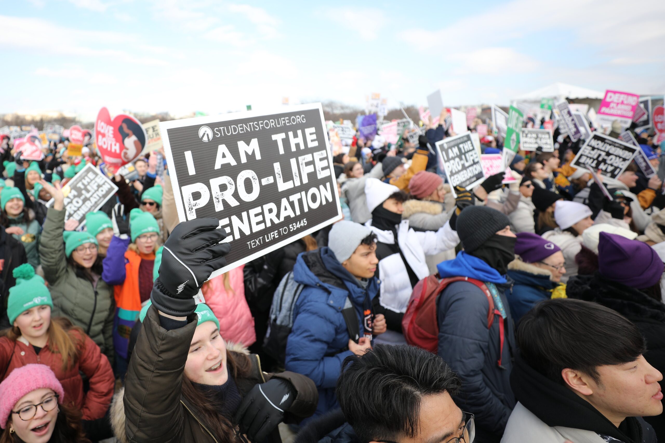 People hold up signs during the 52nd annual March for Life rally in Washington Jan. 24, 2025. (OSV News photo/Bob Roller). (OSV News photo/Bob Roller)