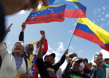 Venezuelans living in Colombia hold Venezuelan flags as they gather at Plaza de Bolivar to celebrate in Bogota, Jan. 3, 2026, after U.S. President Donald Trump said the U.S. has struck Venezuela and captured its President Nicolas Maduro. (OSV News photo/Andres Galeano, Reuters)