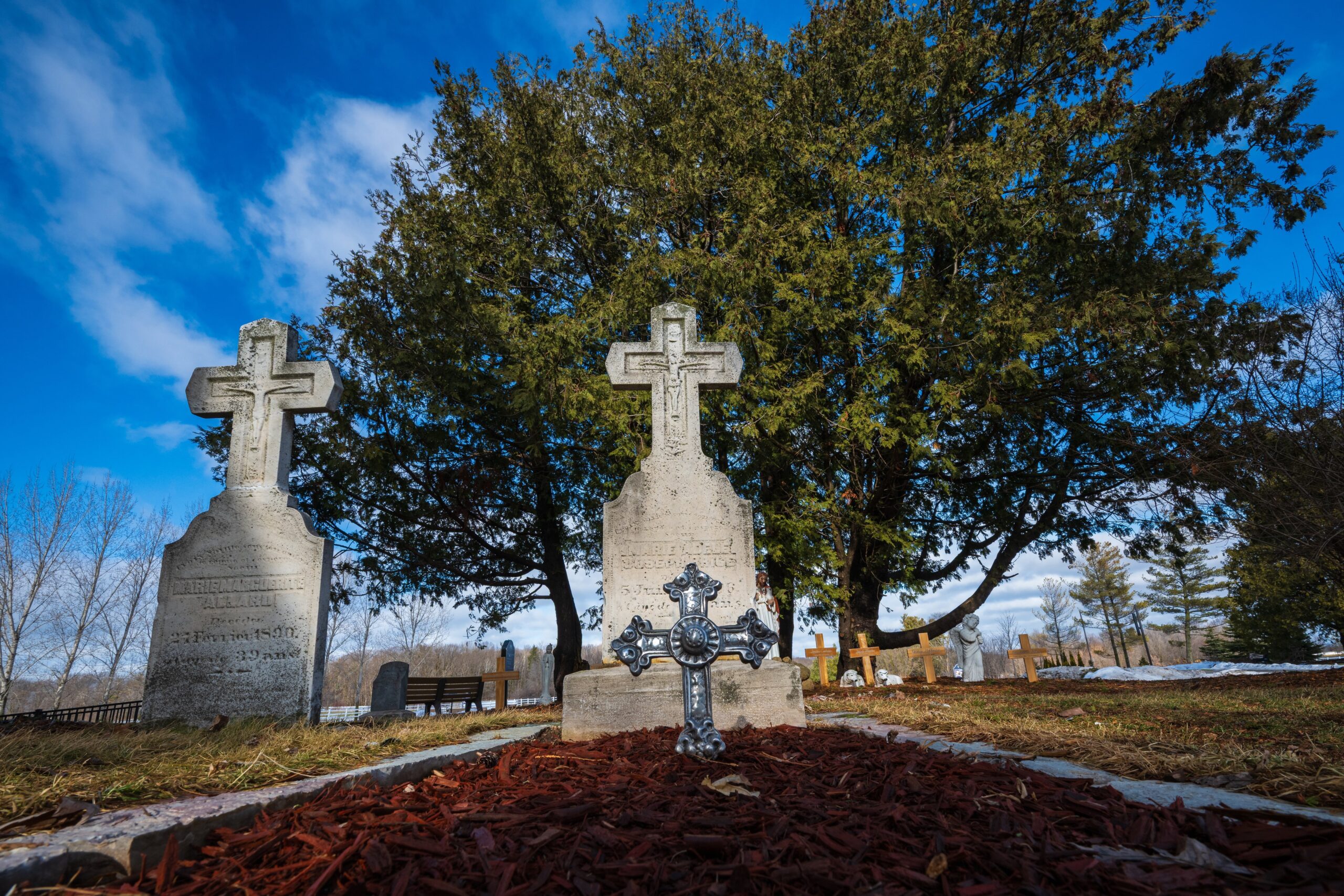 The grave of Adele Brice (Brise), center, pictured in a Jan. 9, 2026, photo, is a place that visitors to the National Shrine of Our Lady of Champion often stop and pray. The Diocese of Green Bay, Wis., formally opened the cause for the beatification and canonization of Adele Brice Jan. 30, 2026. (OSV News photo/Sam Lucero)