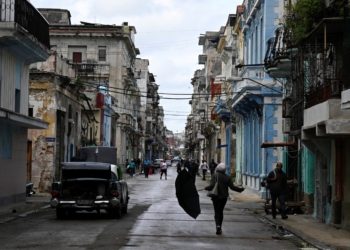 People walk on the street in Havana, as Cubans from all walks of life hunker into survival mode, navigating seemingly interminable blackouts and soaring prices for food, fuel, and transport, while the United States threatens a stranglehold on the communist-run nation, Cuba, January 30, 2026. (OSV News photo/Norlys Perez, Reuters)