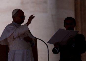 Pope Leo XIV blesses a baby as he arrives to hold the weekly general audience in St. Peter's Square at the Vatican, Feb. 18, 2026. (OSV News photo/Remo Casilli, Reuters)