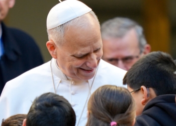 Pope Leo XIV greets children during a pastoral visit to the Basilica of the Sacred Heart of Jesus in central Rome Feb. 22, 2026. (CNS photo/Lola Gomez)