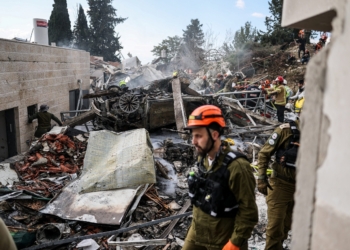 Emergency personnel work at the site of an Iranian strike, after Iran launched missile barrages following attacks by the U.S. and Israel on Feb. 28, 2026, in Beit Shemesh, Israel March 1. (OSV News photo/Ammar Awad, Reuters)