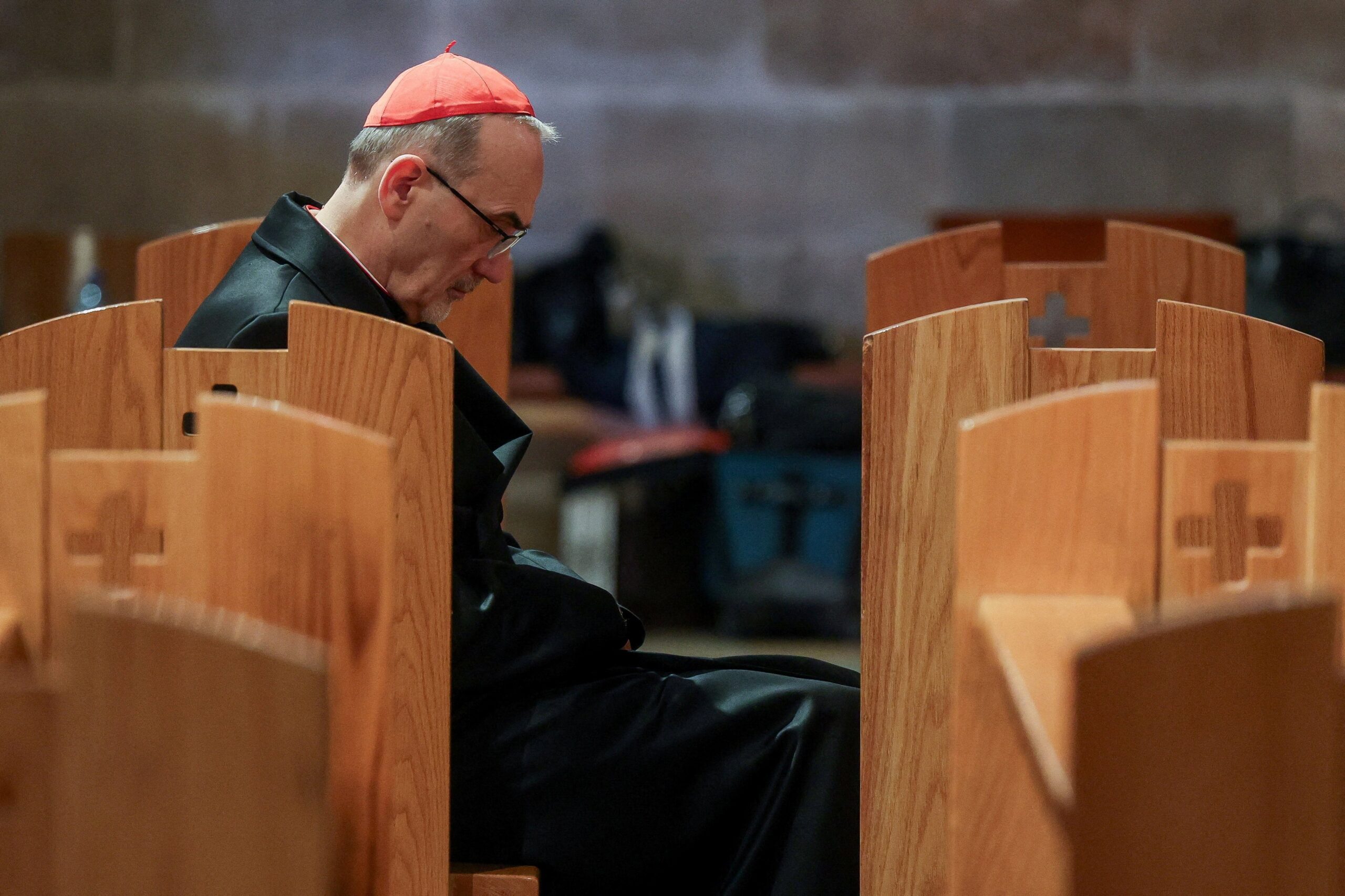 Cardinal Pierbattista Pizzaballa, the Latin Patriarch of Jerusalem, sits in the Church of All Nations March 29, 2026, at a prayer service to mark Palm Sunday, following the cancellation of the traditional Palm Sunday procession from the Mount of Olives, amid restrictions on gathering in large groups and the U.S.-Israeli conflict with Iran, in Jerusalem.