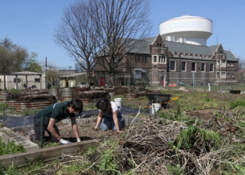 Photos by Lori M. Nichols
Akash Rudra, a student from Saint Joseph’s Collegiate Institute in Buffalo, N.Y., left, works in the community garden April 10 alongside Natasha Roach, director of nutrition and agriculture at The Neighborhood Center in the City of Camden. The students were taking part in the Romero Center's Urban Challenge, a weeklong program in which they learn about poverty and Jesus’ call to serve others.