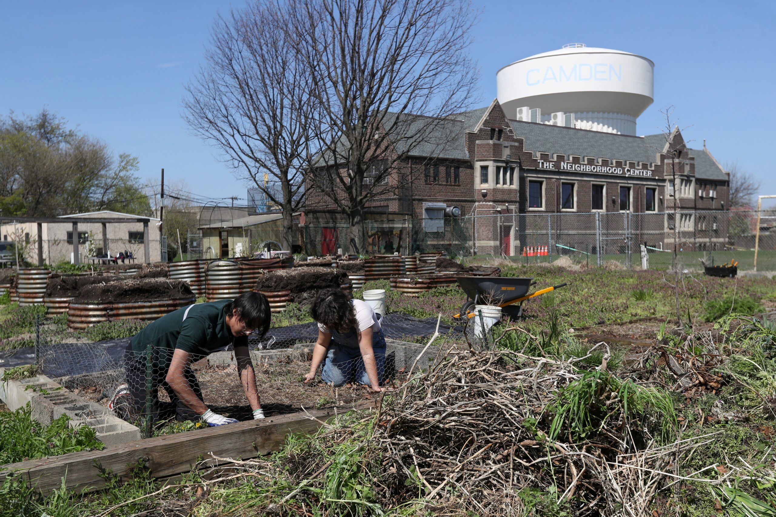 Photos by Lori M. Nichols
Akash Rudra, a student from Saint Joseph’s Collegiate Institute in Buffalo, N.Y., left, works in the community garden April 10 alongside Natasha Roach, director of nutrition and agriculture at The Neighborhood Center in the City of Camden. The students were taking part in the Romero Center's Urban Challenge, a weeklong program in which they learn about poverty and Jesus’ call to serve others.