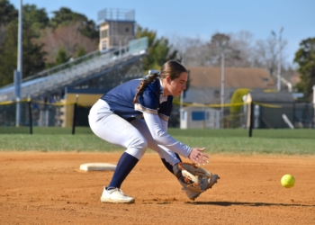 Photos by Mark Zimmaro
Madi Berry, Holy Spirit High School senior shortstop, takes infield practice prior to a game against Cape May County Technical High School on April 11.
