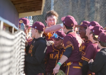 the Rams celebrate a 2-run home run by Brayden Moughan (5) in the third inning of the Mid-Atlantic Baseball Challenge game against St. Augustine Prep on April 8.  (Photos by Tim Hawk)