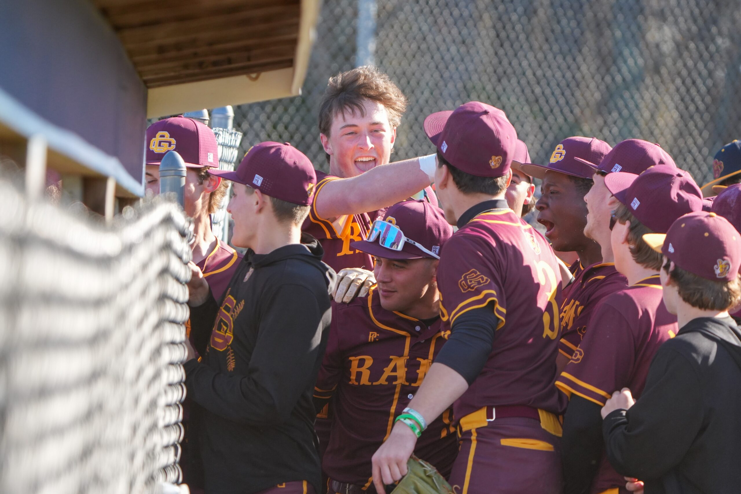 the Rams celebrate a 2-run home run by Brayden Moughan (5) in the third inning of the Mid-Atlantic Baseball Challenge game against St. Augustine Prep on April 8.  (Photos by Tim Hawk)