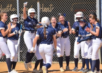 Photos by Mark Zimmaro
Holy Spirit High School senior Madi Berry (No. 7) is congratulated by teammates after hitting a grand slam in a 16-6 win over Cape May County Tech at the At Bats for Autism Acceptance Softball Invitational.