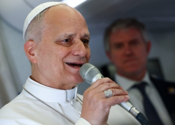 Pope Leo XIV speaks to members of the media aboard the papal plane April 15, 2026, en route to Yaounde, Cameroon, amid his apostolic journey. Pope Leo XIV spoke to journalists on the five-hour flight from Algeria to Cameroon, underlining St. Augustine's enduring importance today, saying that the saint's invitation "to search for God and to search for truth is something that is very much needed today." (OSV News photo/Guglielmo Mangiapane/Pool