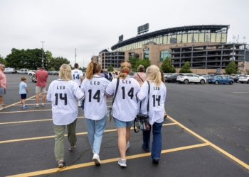 A family arrives ahead of a June 14, 2025, Mass in honor of Pope Leo XIV at Rate Field in Chicago, home of the Chicago White Sox baseball team. The Chicago-born pontiff, elected May 8, is the first American pope in history. (OSV News photo/Carlos Osorio, Reuters)