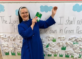 Courtesy photos
Sister smiles as she stands in front of a poster that reads, “The Lord is my Shepherd.” Of her vocation, she says, “My days are filled with joy, love, peace and happiness, as well as struggles to give my very best, because gold must be tested in fire.”