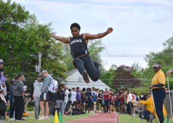 Photos by Mark Zimmaro 
Noah Glenn, Bishop Eustace Preparatory School senior, leaps through the air in the long jump at the Camden County Championships on May 9 at Haddon Township High School.