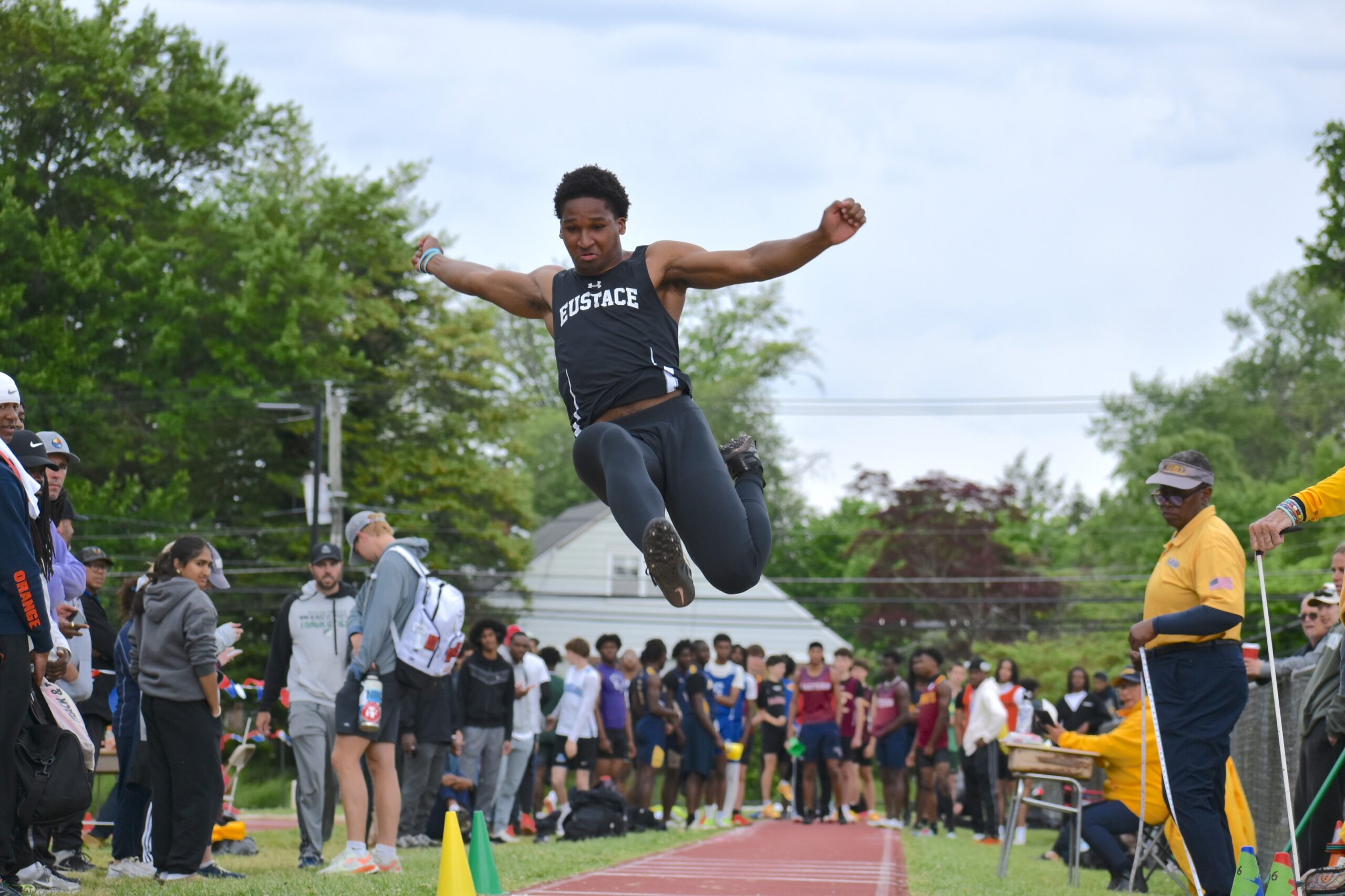 Photos by Mark Zimmaro 
Noah Glenn, Bishop Eustace Preparatory School senior, leaps through the air in the long jump at the Camden County Championships on May 9 at Haddon Township High School.