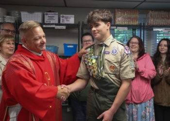 Deacon Richard Wigglesworth thanks Boy Scout Caleb Akerlind for his assistance in renovating the Saint Elizabeth Ann Seton Annex for the new Social Action Center, which houses the food pantry. Akerlind worked on this renovation for his Eagle Scout project.