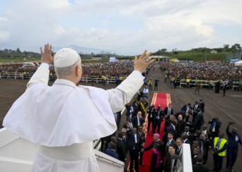 Pope Leo XIV gestures to the crowd as he boards the papal plane at Bamenda International Airport in Cameroon April 16, 2026, en route to in Yaoundé, Cameroon. Pope Leo XIV’s first encyclical, "Magnifica Humanitas," will be published May 25, addressing artificial intelligence and the protection of human dignity, the Vatican announced May 18, 2026. (OSV News photo/Simone Risoluti, Vatican Media)