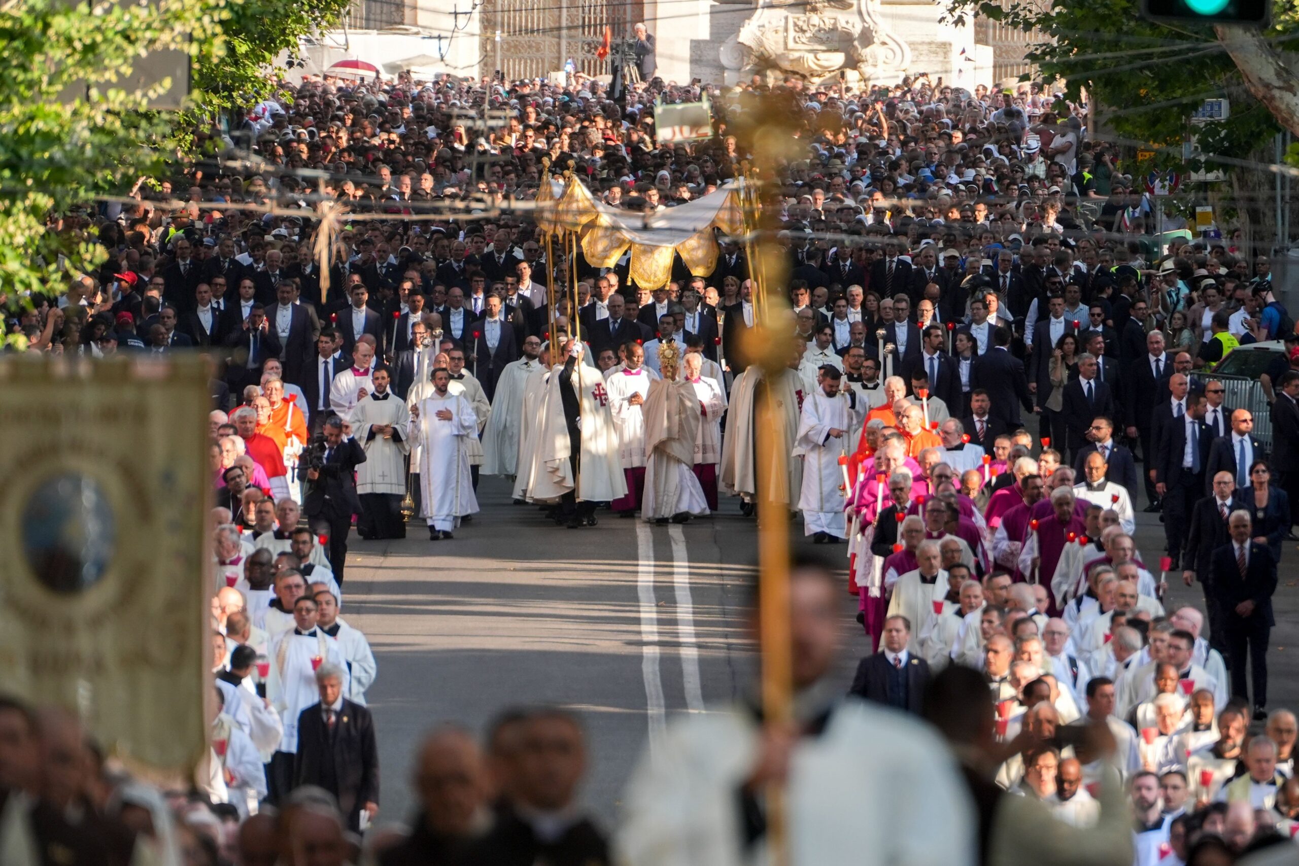 Under a canopy, Pope Leo XIV carries the Eucharist in a monstrance during a Corpus Christi procession from Rome's Basilica of St. John Lateran to the Basilica of St. Mary Major June 22, 2025. (CNS photo/Lola Gomez)