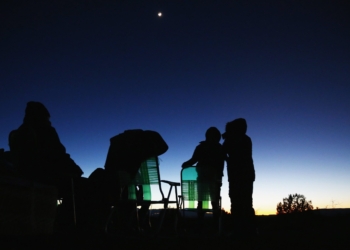 People are pictured in a file photo using night vision goggles to look at the night sky during an Unidentified Flying Object (UFO) tour in the desert outside Sedona, Ariz. UAPs -- once known as UFOs -- and the intelligence behind their existence has long been a source of public fascination, but Catholic theologians and scientists have also been thinking about their implications on how humanity sees itself in relation to its Creator. (OSV News photo//Mike Blake, Reuters)