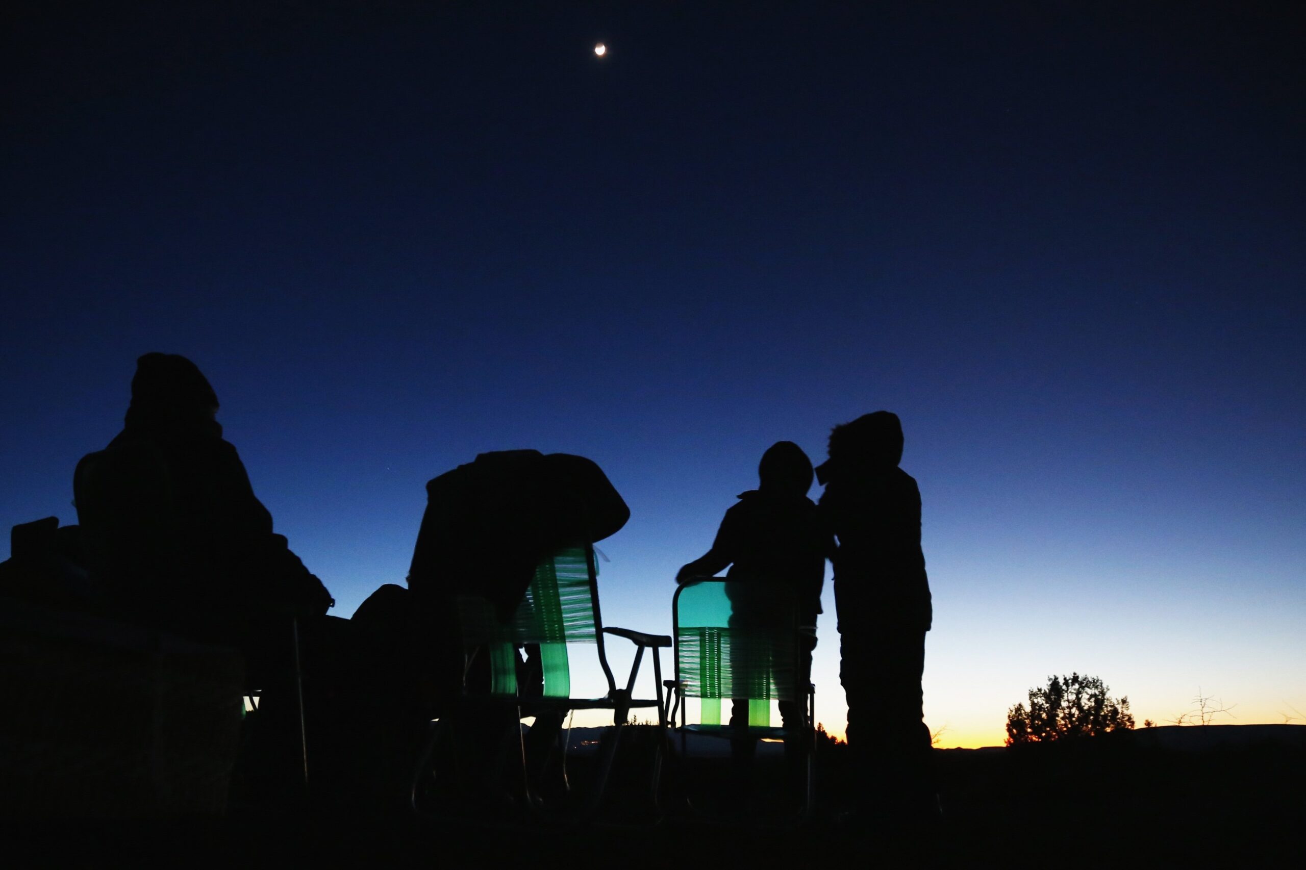 People are pictured in a file photo using night vision goggles to look at the night sky during an Unidentified Flying Object (UFO) tour in the desert outside Sedona, Ariz. UAPs -- once known as UFOs -- and the intelligence behind their existence has long been a source of public fascination, but Catholic theologians and scientists have also been thinking about their implications on how humanity sees itself in relation to its Creator. (OSV News photo//Mike Blake, Reuters)