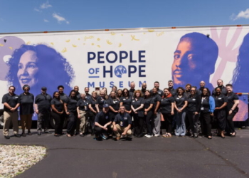 Staff from Catholic Charities USA and Catholic Charities of South Jersey pose for a photo June 15 outside the People of Hope Museum in the parking lot of the Mantua church. (photo-John Kalitz