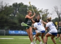 Photos by Mark Zimmaro
Camden Catholic junior Kat Gillern draws three defenders before making a pass in a 24-6 win over Donovan Catholic High School, Toms River.