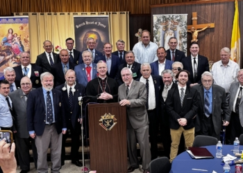 Photo by Neal Cullen
Bishop Joseph Williams poses for a photo with Knights of Columbus during festivities May 30 celebrating the 100th anniversary of the Father Cannon Council 2607 in Carneys Point.
