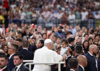 Pope Leo XIV greets a child as he arrives for a meeting with the diocesan community at the Santiago Bernabeu Stadium in Madrid June 8, 2026, during his June 6-12 apostolic journey to Spain. (OSV News photo/Yara Nardi, Reuters)